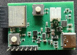 CareTether PCB with its components and connectors on black fabric.